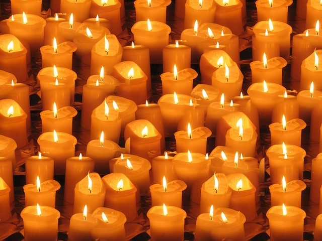 Columns of orange candles with yellow flames.