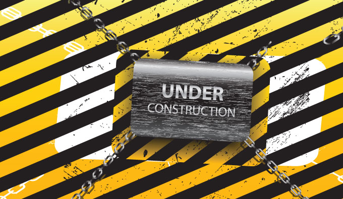 Black box that says UNDER CONSTRUCTION on an orange and white background with black vertical stripes